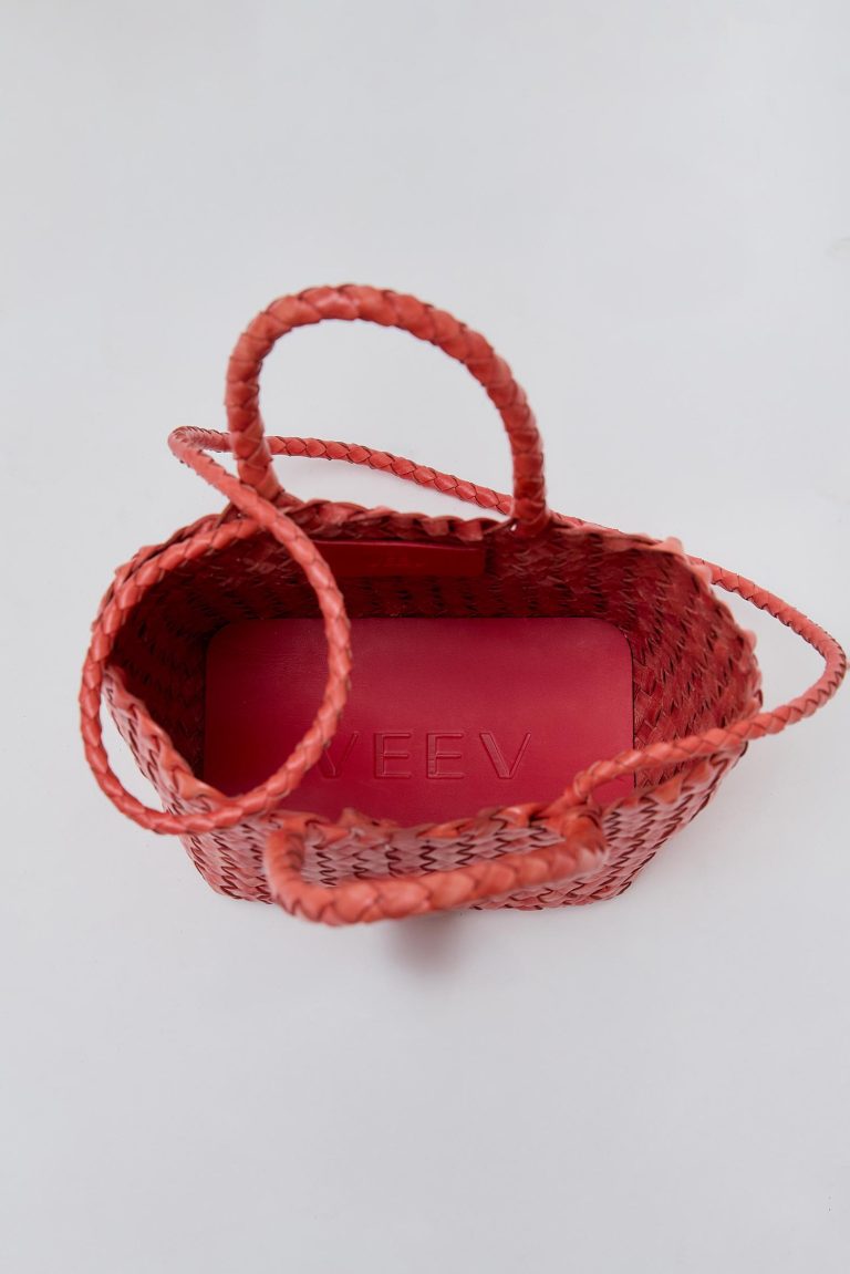 veev logo on the bottom of a red bag
