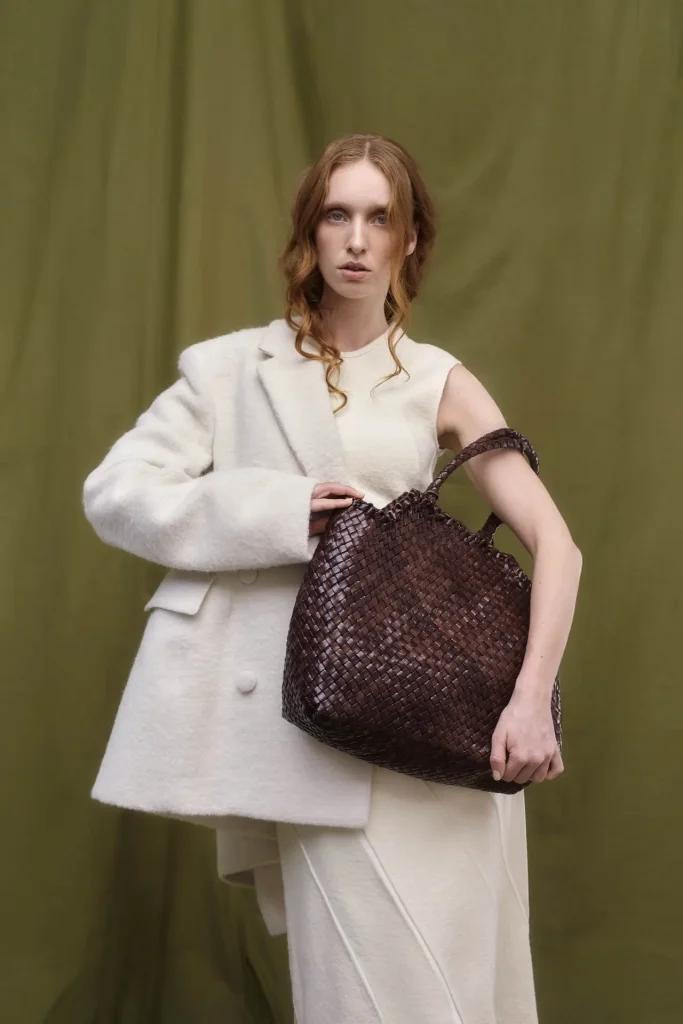 Model wearing a brown shoulder bag